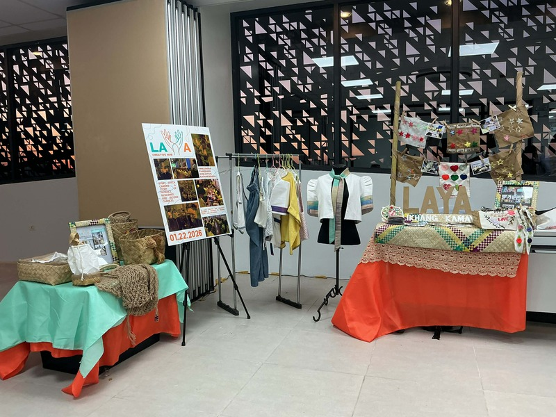 Laya Creative Hub display featuring handcrafted products, garments, and community showcase materials